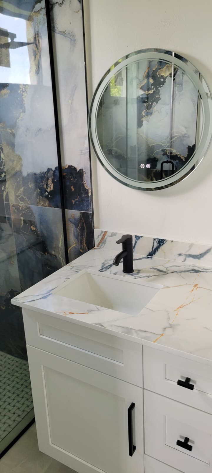 Modern bathroom with island and premium finishes