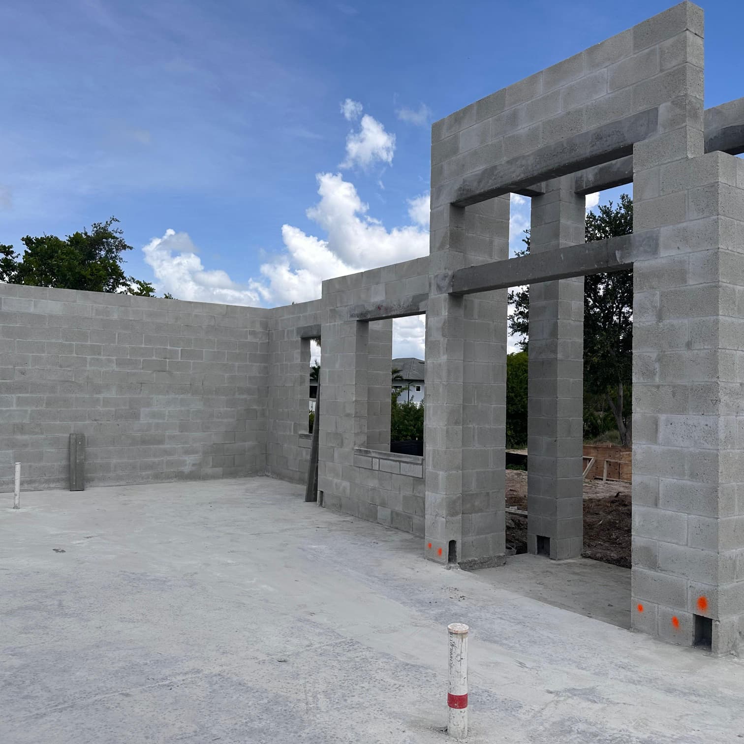 Interior concrete block structure with window and door openings